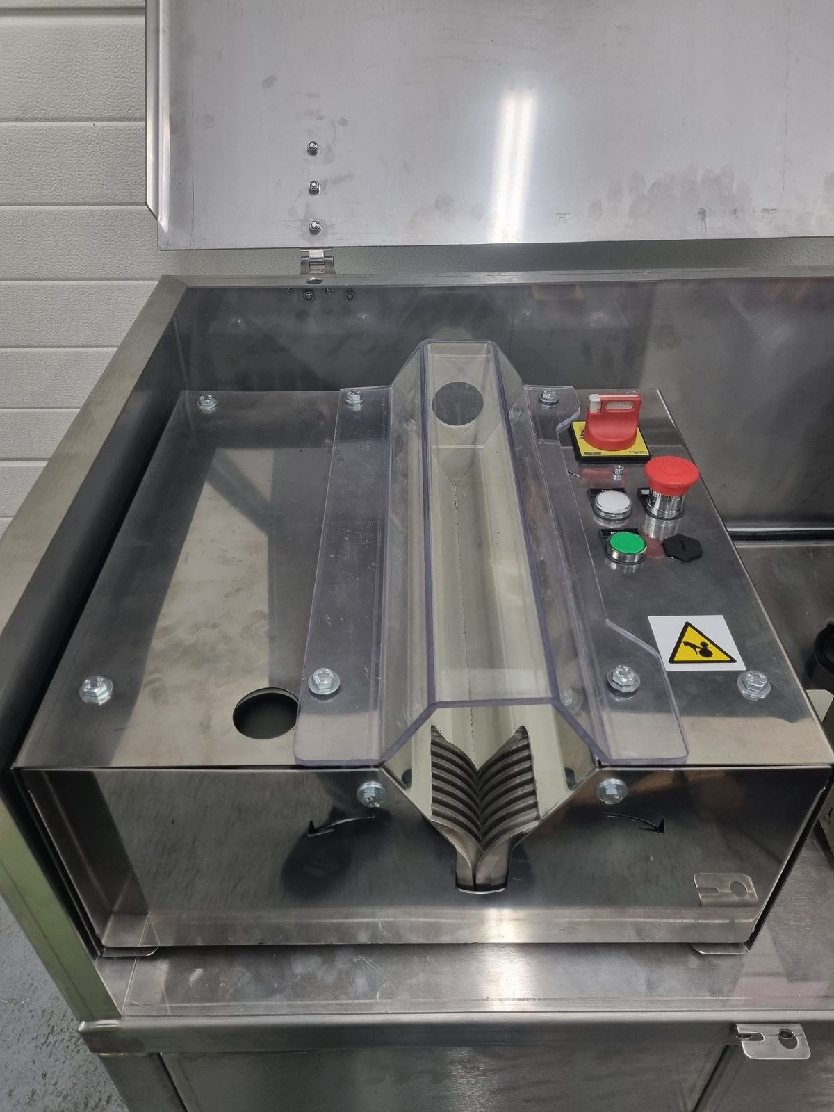 HL machine in the open stainless cabinet